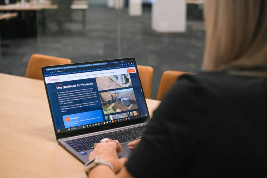 Woman opening Northern Air's website on her laptop